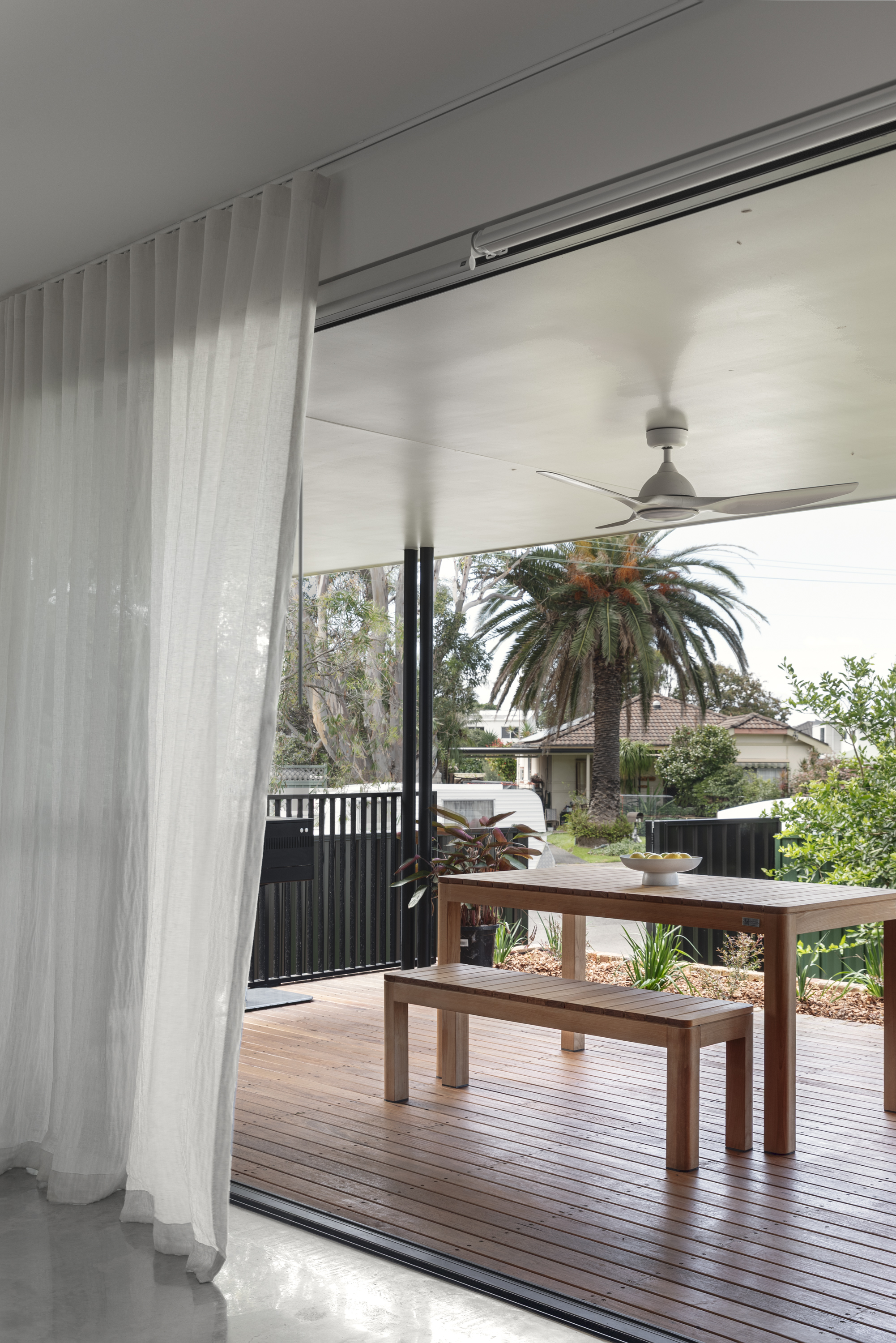 Bedroom with pink linen bedding and balcony outlook
